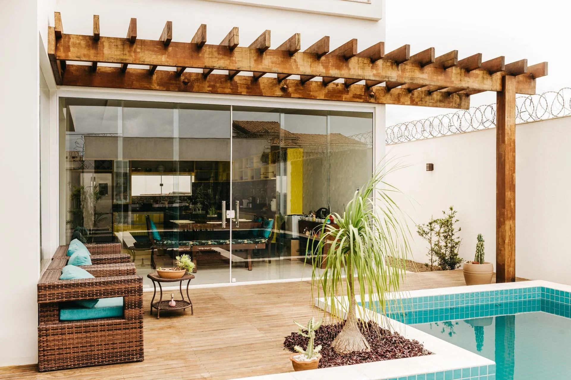Timber pergola attached to a home beside a pool, which may need council approval