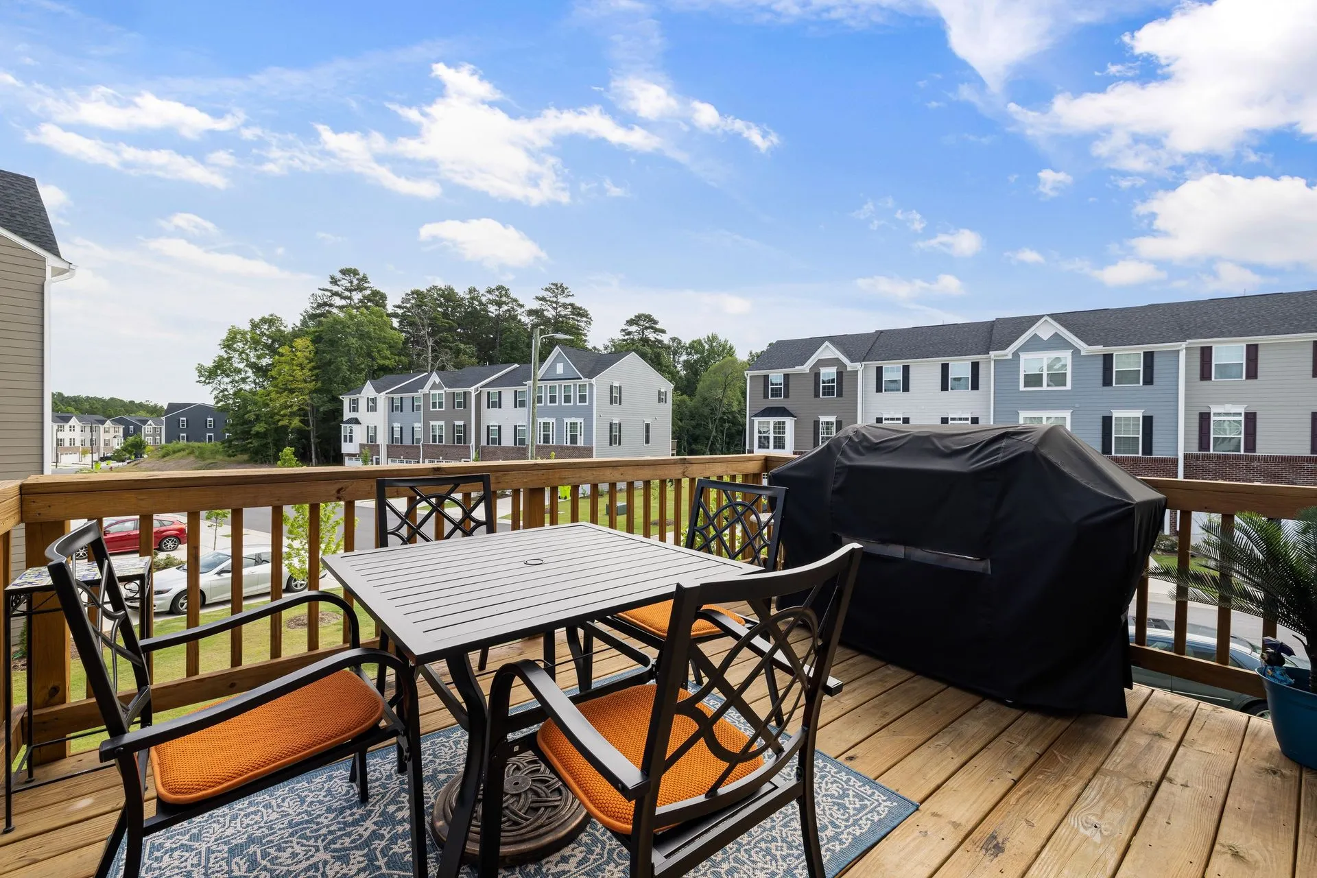 Timber deck with an outdoor dining setting and a barbecue